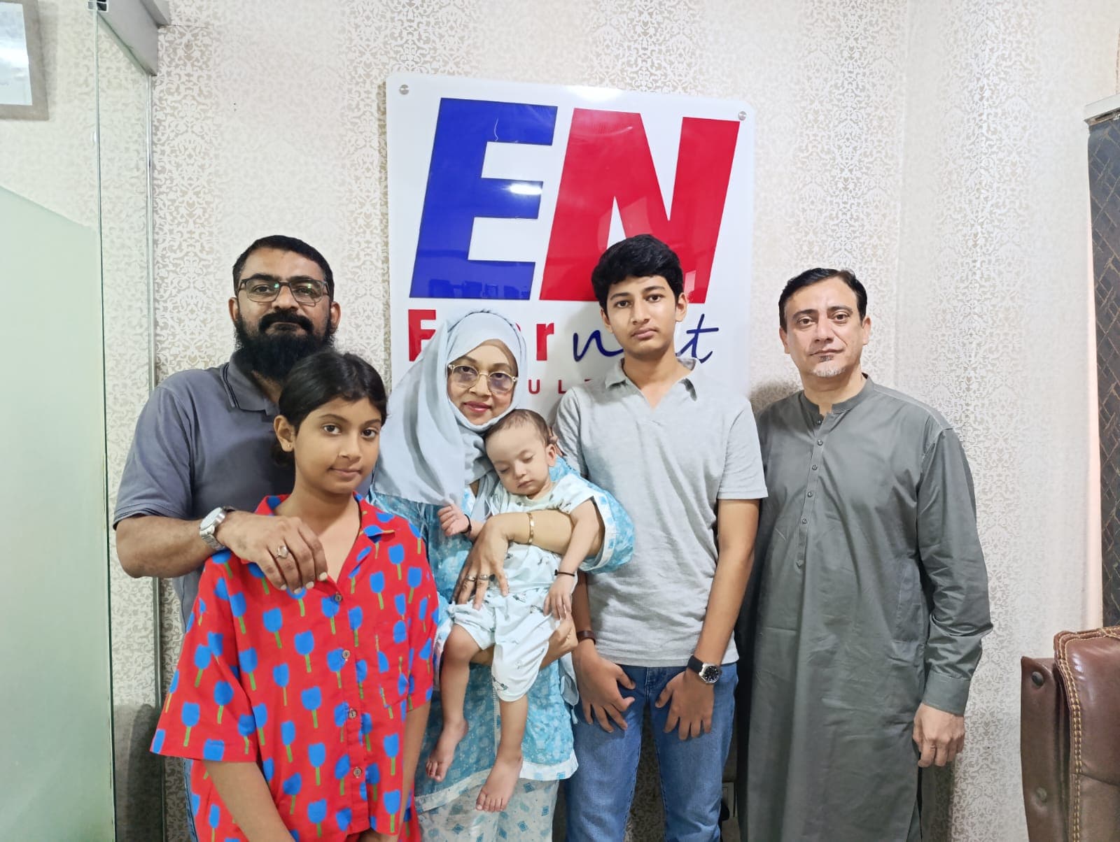 Zia Abdullah and family with Sir Raza at the Evernest Consultants office